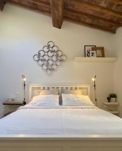 Een bed of bedden in een kamer bij Bed and Breakfast La Bouganville