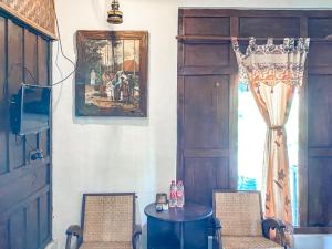 TV a/nebo společenská místnost v ubytování Griya Gribig Guest House Mitra RedDoorz