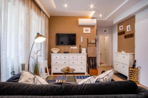 Televízia a/alebo spoločenská miestnosť v ubytovaní MyFlat Casa Premium Apartment