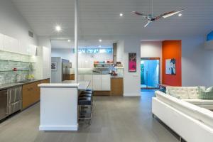 a room with a kitchen and a living room at Villa Tranquilo home in Palm Springs