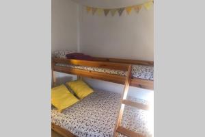 two bunk beds in a room with a ladder at Casa El Castellet en Polop. in Polop +13 photos