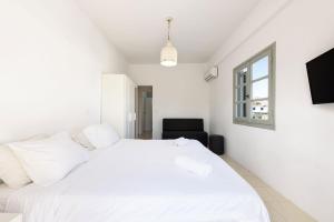Posteľ alebo postele v izbe v ubytovaní Strata Home by Rocks Estates