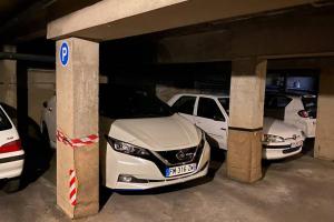 a group of cars parked in a parking garage at Feel@Home Nemausus « Le 21 » in Nîmes