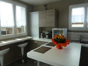 a kitchen with a sink and a window at Roissy Chambres in Roissy-en-France