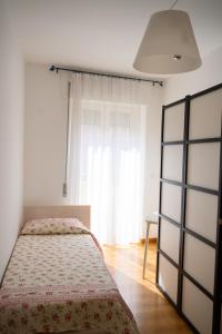 מיטה או מיטות בחדר ב-L'Attichetto