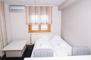 Rúm í herbergi á Apartmani Biser