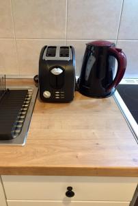 a toaster and a toaster sitting on a counter at Nikoletta's Studio 2 in Komotini