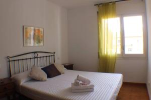 Ένα ή περισσότερα κρεβάτια σε δωμάτιο στο Agi Montserrat