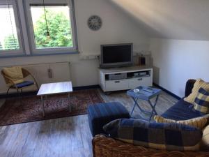 Μια τηλεόραση ή/και κέντρο ψυχαγωγίας στο Ferienwohnung Sonnengelb