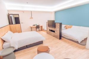 Postel nebo postele na pokoji v ubytování The Pai Hotel