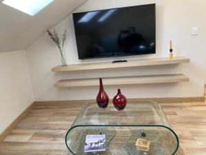 Telewizja i/lub zestaw kina domowego w obiekcie Fuencarral Apartments