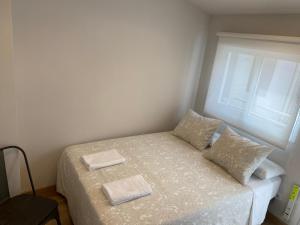 Łóżko lub łóżka w pokoju w obiekcie Fuencarral Apartments