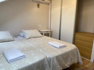 Łóżko lub łóżka w pokoju w obiekcie Fuencarral Apartments