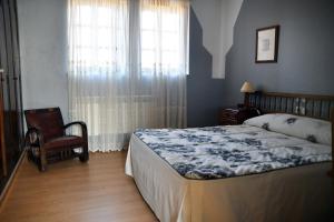 Giường trong phòng chung tại Casa Rural Molino Del Arriero
