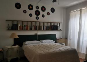 Postel nebo postele na pokoji v ubytování B&B LaMaGia di Corte Moronati