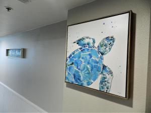 a picture of a turtle on a wall at 17th Floor 1 BR Resort Condo Direct Oceanfront Wyndham Ocean Walk Resort Daytona Beach 1706 in Daytona Beach