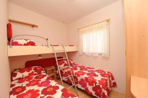Camping Village Scaglieri客房内的一张或多张床位