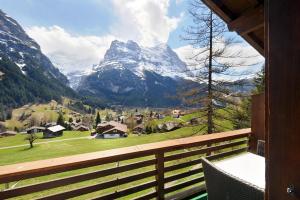 a balcony with a view of a mountain at Apartments Kirchbühl in Grindelwald