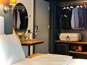 a bedroom with a bed and a dressing room at Weingart Istanbul in Istanbul