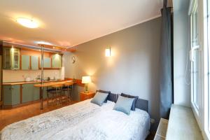 Posteľ alebo postele v izbe v ubytovaní Flatbook Apartamenty - Krynica Morska Żeromskiego