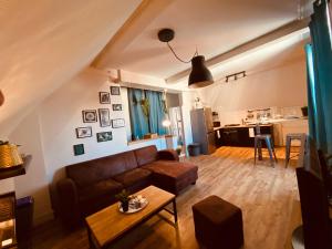 a living room with a couch and a table at Under Roof in Clermont-Ferrand +35 photos