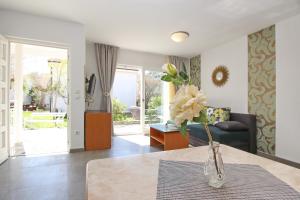 a living room filled with furniture and a window at Villas Corinthia in Baška