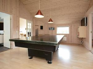 a large room with a ping pong table in it at Holiday home Væggerløse LX in Marielyst