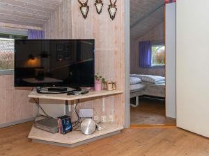 a living room with a flat screen tv on a wall at Tranquil Retreat in Mommark - By Traum Ferienwohnungen in Vibøge