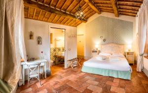 Postel nebo postele na pokoji v ubytování Agriturismo Il Segreto di Pietrafitta + 37 fotografií