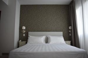 Posteľ alebo postele v izbe v ubytovaní Hotel Portavaldera
