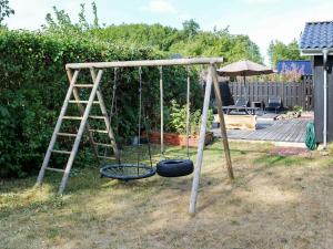 Children's play area sa 9 person holiday home in Hadsund