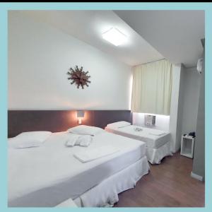 Cama ou camas em um quarto em Excellence Comfort Hotel