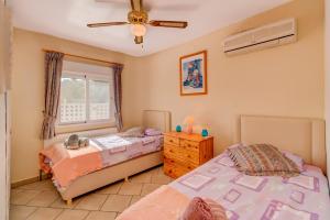 Posteľ alebo postele v izbe v ubytovaní Villa Atlas by Villa Plus