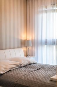 Ένα ή περισσότερα κρεβάτια σε δωμάτιο στο Papillon Apartamenty Gdańsk