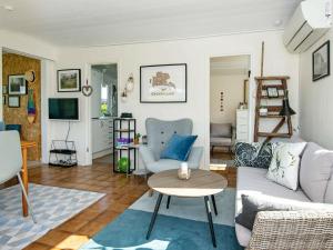 a living room with a couch and a table at 4 person holiday home in Broager-By Traum in Broager