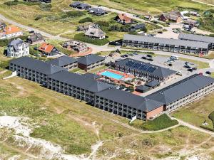 an aerial view of a building with a pool at 4 person holiday home on a holiday park in Fanø in Fanø