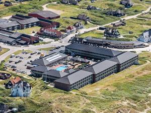 an overhead view of a building with a parking lot at 4 person holiday home on a holiday park in Fanø in Fanø