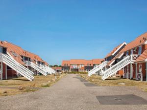 a row of white stairs on a campus at 6 person holiday home on a holiday park in Borre in Borre