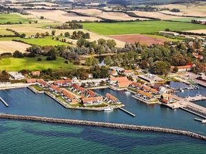uma vista aérea de um porto com barcos na água em 6 person holiday home on a holiday park in Borre em Borre