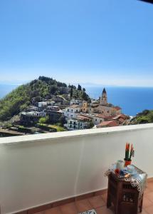 a view of a city from a white wall at L'Arabesco Apartment in Amalfi