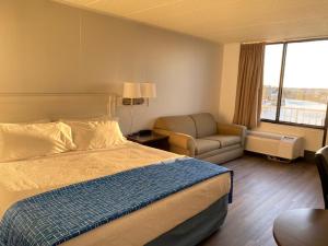 Postel nebo postele na pokoji v ubytování Fenwick Islander Motel + 32 fotografií