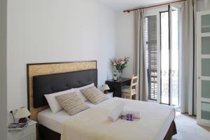 Posteľ alebo postele v izbe v ubytovaní Hostal Balkonis