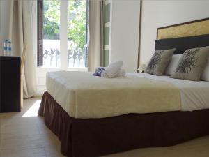 Posteľ alebo postele v izbe v ubytovaní Hostal Balkonis