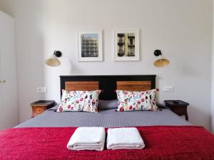 En eller flere senge i et værelse på Casa Consell Gran Via, Guest House