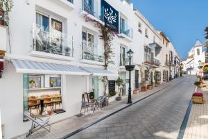a street in a town with white buildings at Linda Boutique Hotel in Marbella