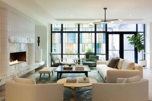 a living room with a couch and a fireplace at Kimpton Sylvan Hotel Buckhead Atlanta in Atlanta