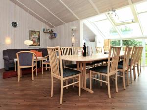 a dining room with a table and chairs at 12 person holiday home in Otterndorf in Otterndorf