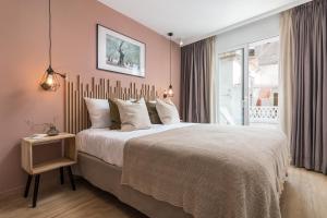 מיטה או מיטות בחדר ב-Linda Boutique Hotel