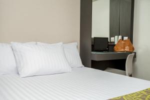 Postel nebo postele na pokoji v ubytování Eco Star Hotel