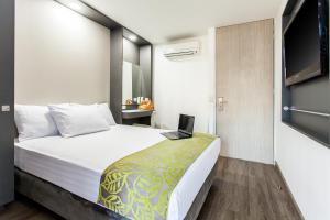 Postel nebo postele na pokoji v ubytování Eco Star Hotel